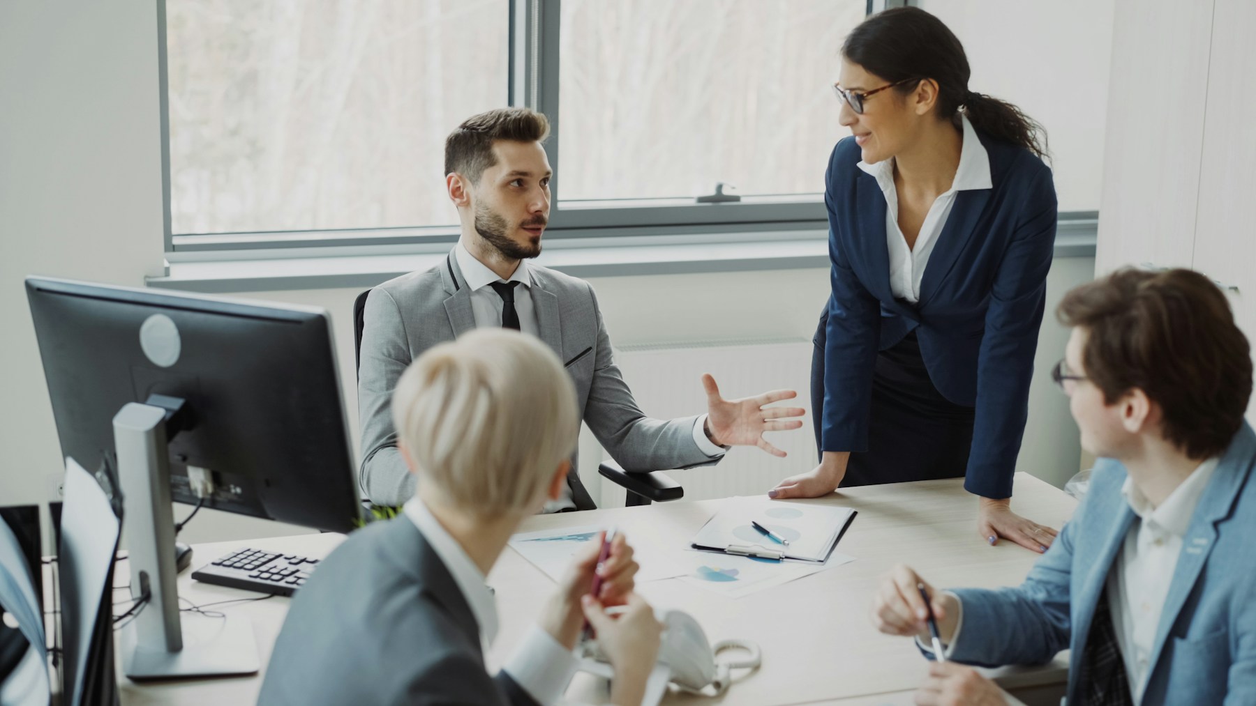 Business professionals collaborating around a conference table